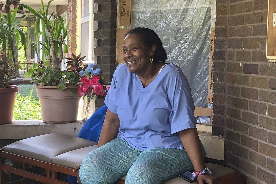 Deloris Knight of Detroit, Mich., sits on her front porch, Wednesday, July 17, 2019, as she pre ...