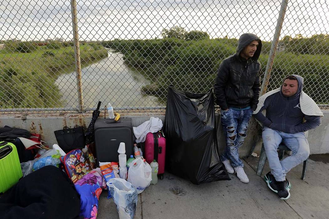 In a Nov. 2, 2018, file photo, Yenly Morales, left, and Yenly Herrera, immigrants from Cuba see ...