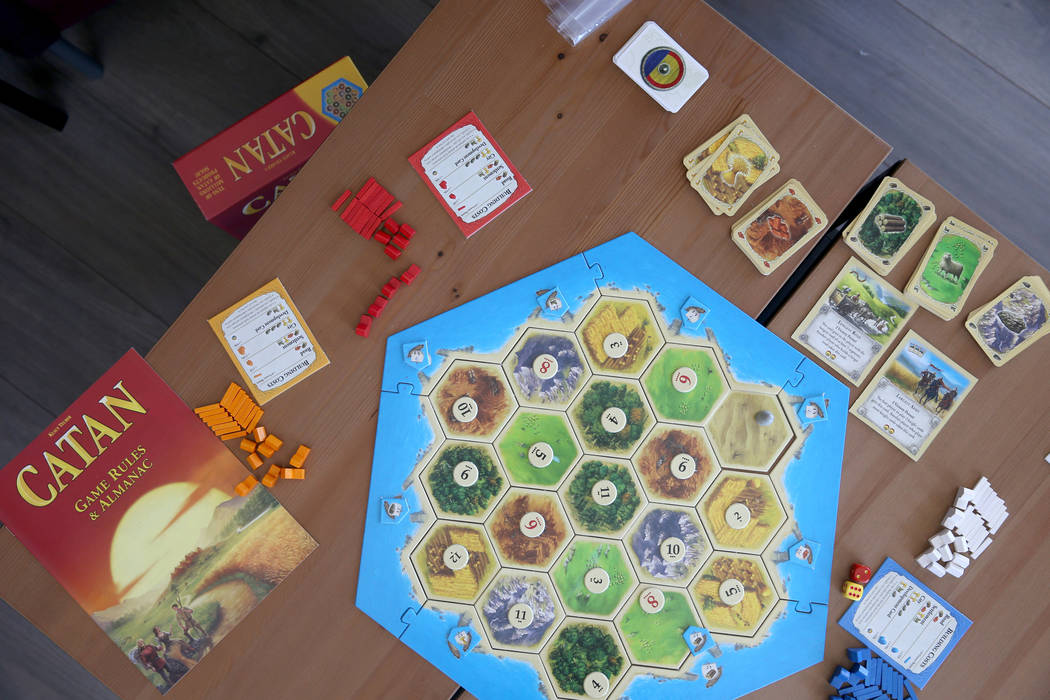 The game "Catan" at Boarding School Games in Las Vegas, owned by Emily Labejof and Ma ...