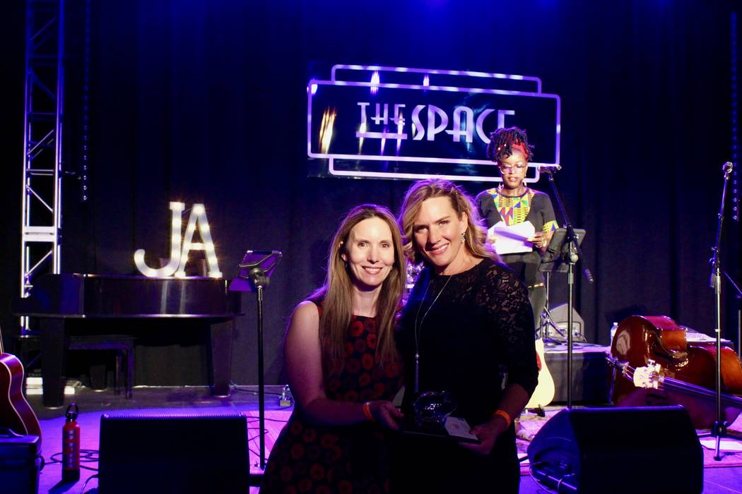 Jennifer Bambao, left, and Denise Polsfut are seen after Polsfut received her award at a ceremo ...