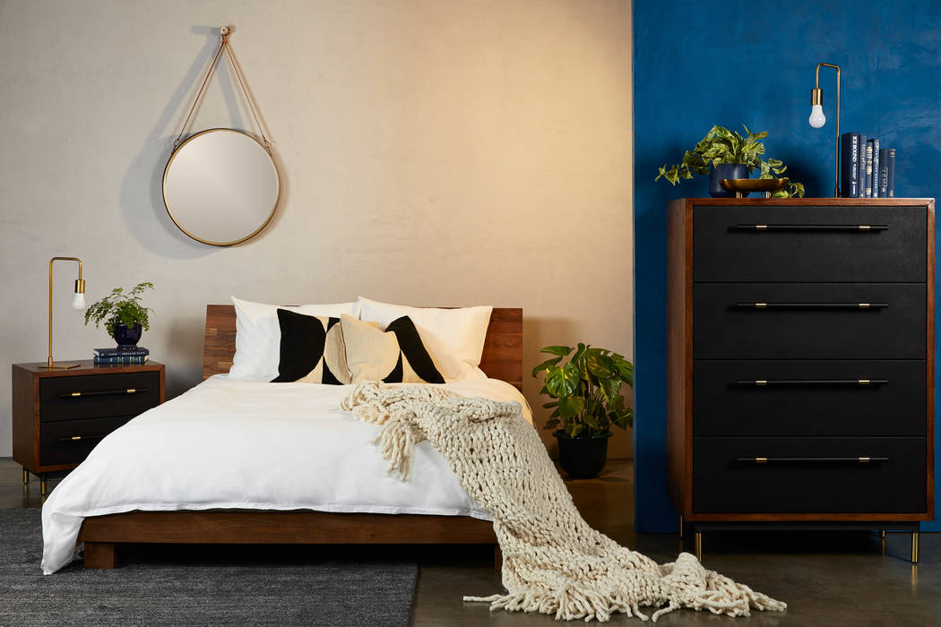 With distinct stylings, Fernish's Roxbury bedroom features black faux leather accents on the dr ...