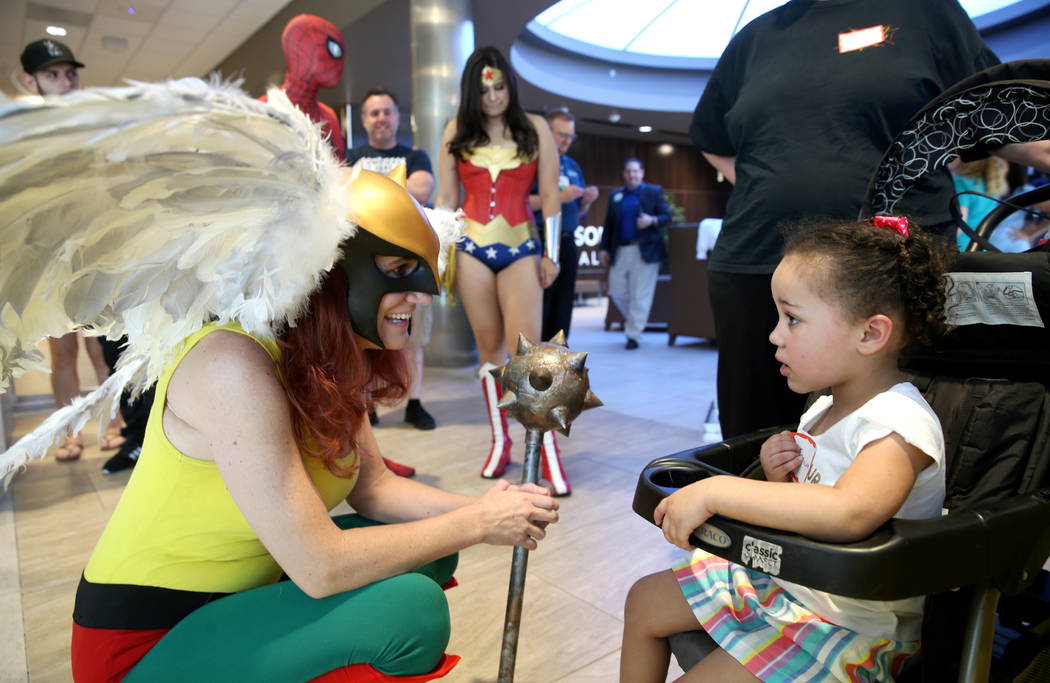 Marry Ann Nocie as Hawkgirl greets JernieLynn Montgomery, 3, during the first-ever Neonatal Int ...