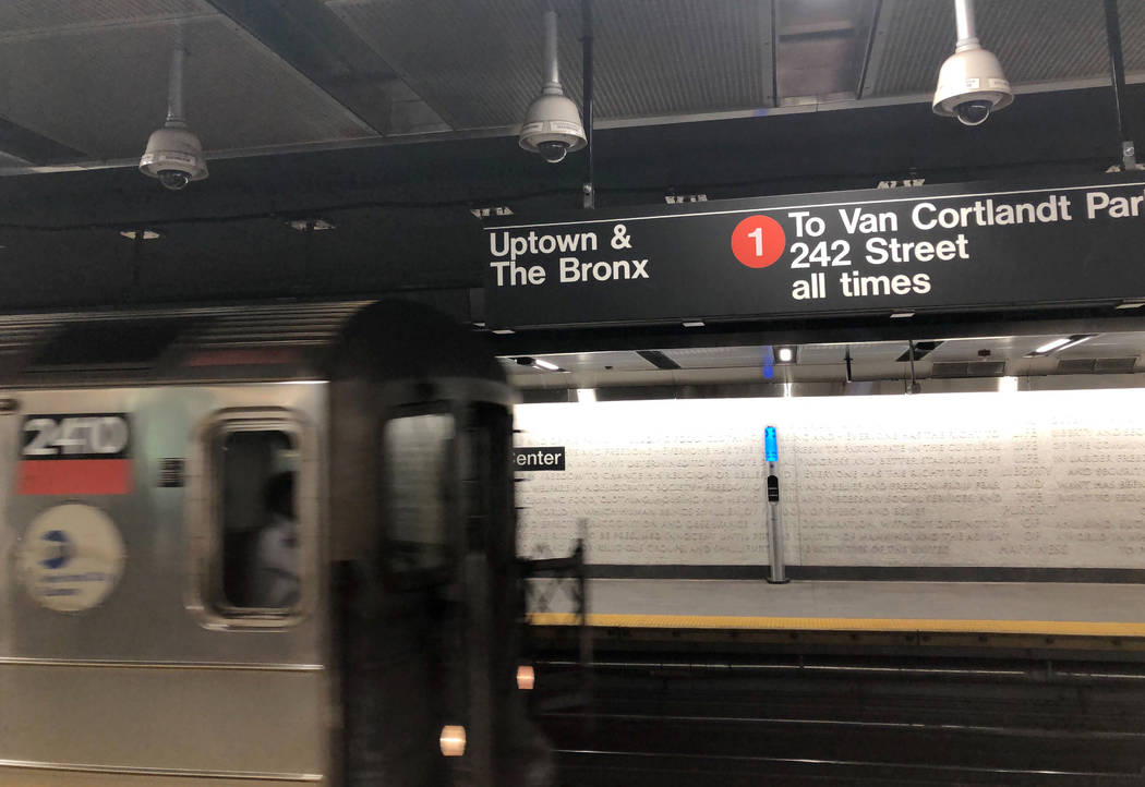 A New York City subway train slowly arrives at a station near the World Trade Center, Friday, J ...