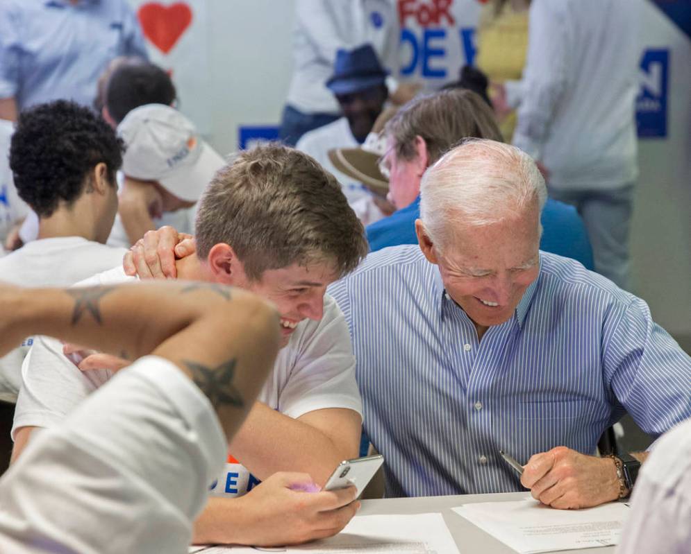 Democratic presidential candidate former Vice President Joe Biden, right, shares a laugh with A ...