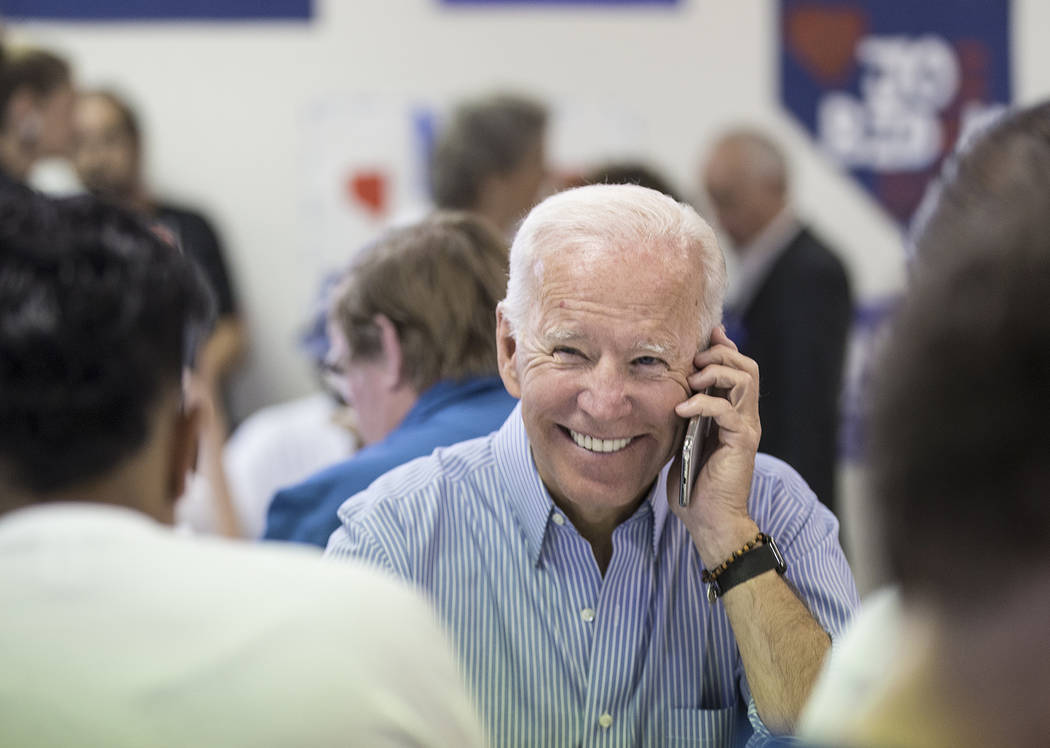 Democratic presidential candidate former Vice President Joe Biden makes phone calls during the ...