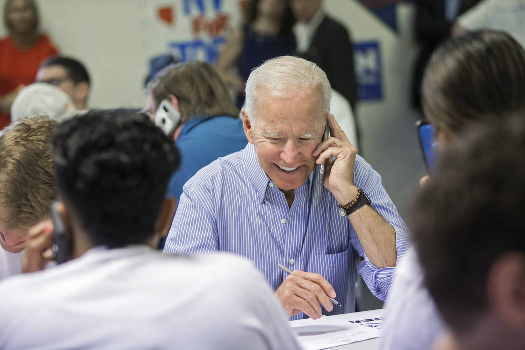 Democratic presidential candidate former Vice President Joe Biden makes phone calls during the ...