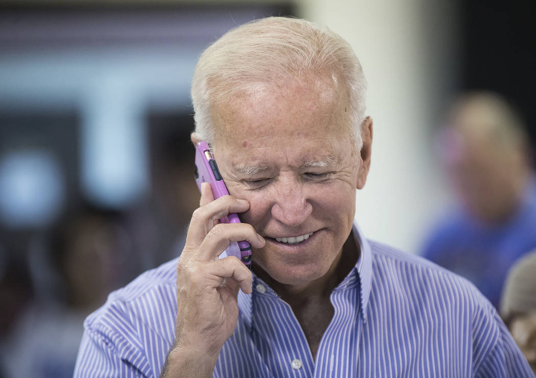 Democratic presidential candidate former Vice President Joe Biden makes phone calls during the ...