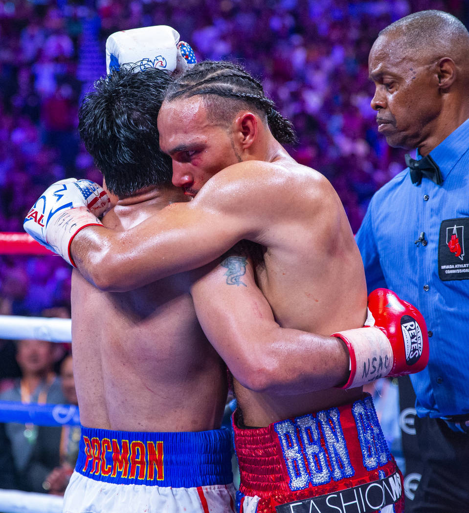 Manny Pacquiao, left, and Keith Thurman embrace in the ring following their WBA super welterwei ...