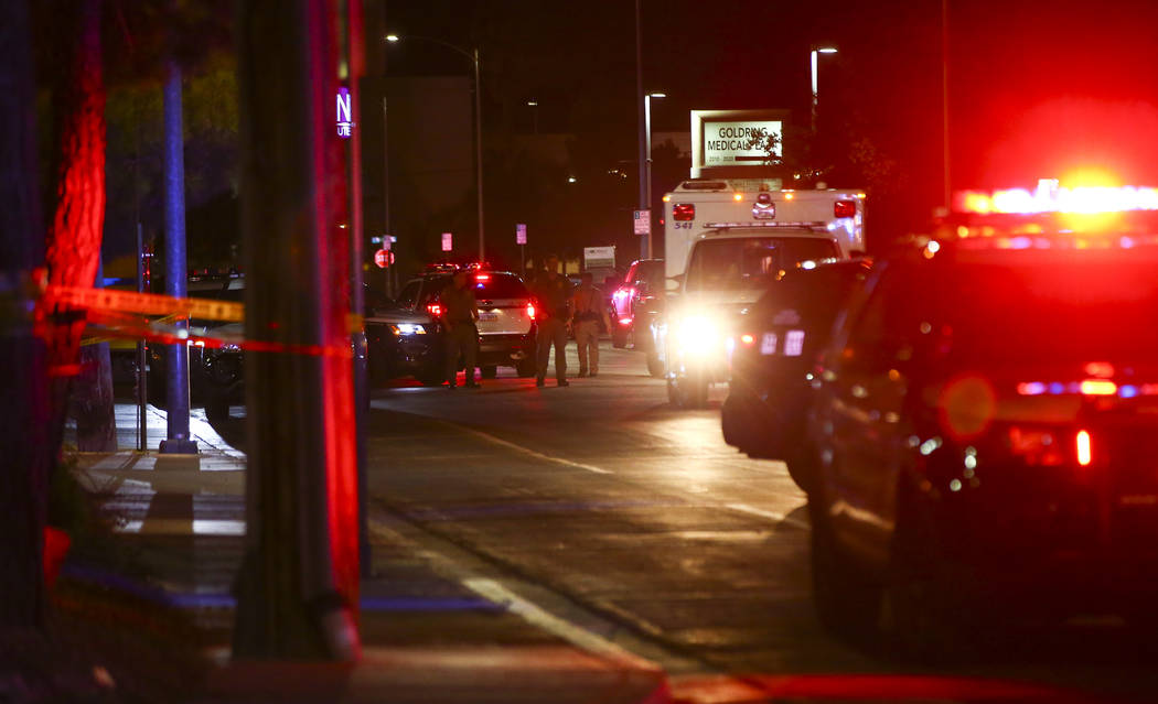 Las Vegas police gather outside of University Medical Center in Las Vegas on Saturday, July 20, ...