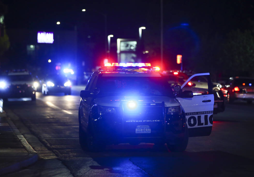 Las Vegas police gather outside of University Medical Center in Las Vegas on Saturday, July 20, ...