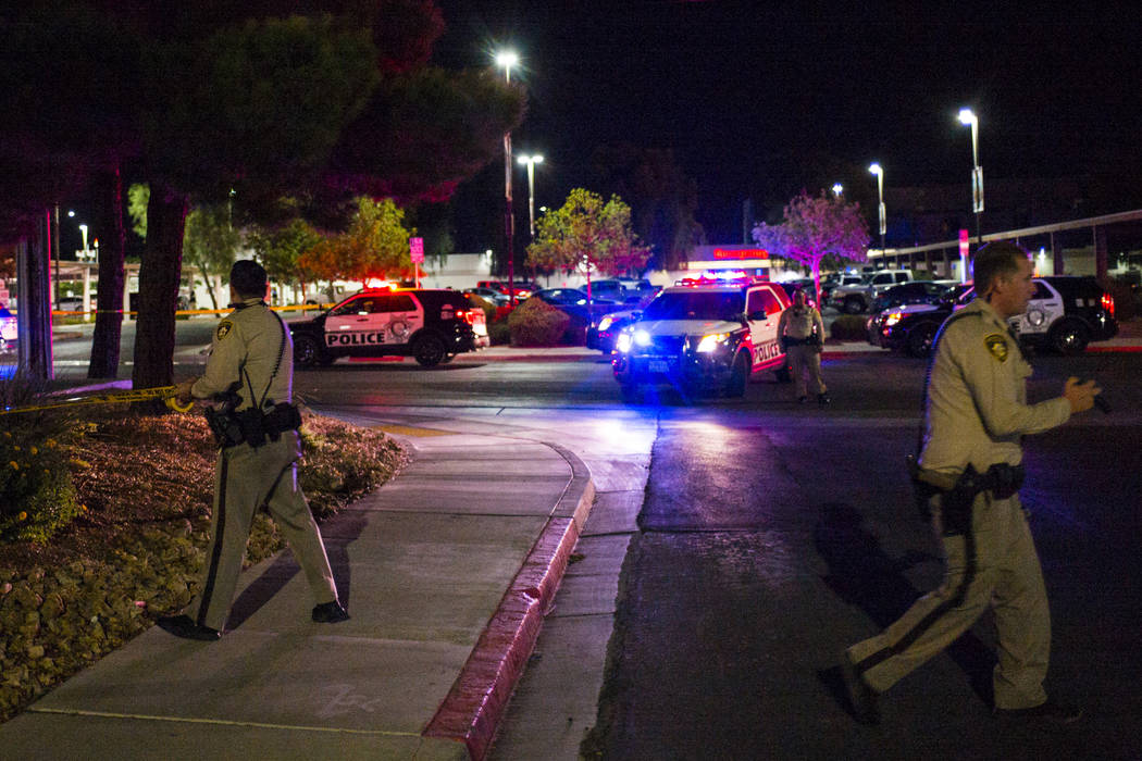 Las Vegas police gather outside of University Medical Center in Las Vegas on Saturday, July 20, ...