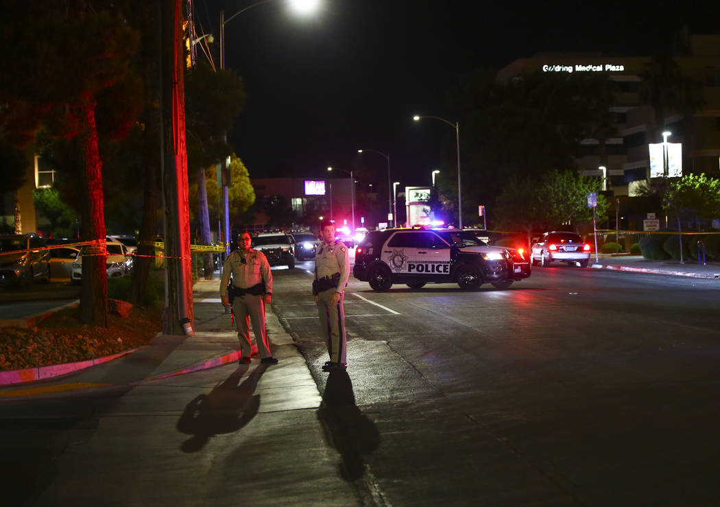 Las Vegas police gather outside of University Medical Center in Las Vegas on Saturday, July 20, ...