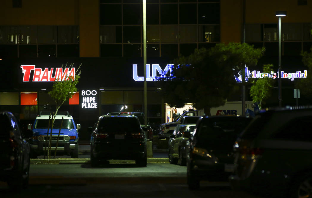 Las Vegas police gather outside of University Medical Center in Las Vegas on Saturday, July 20, ...