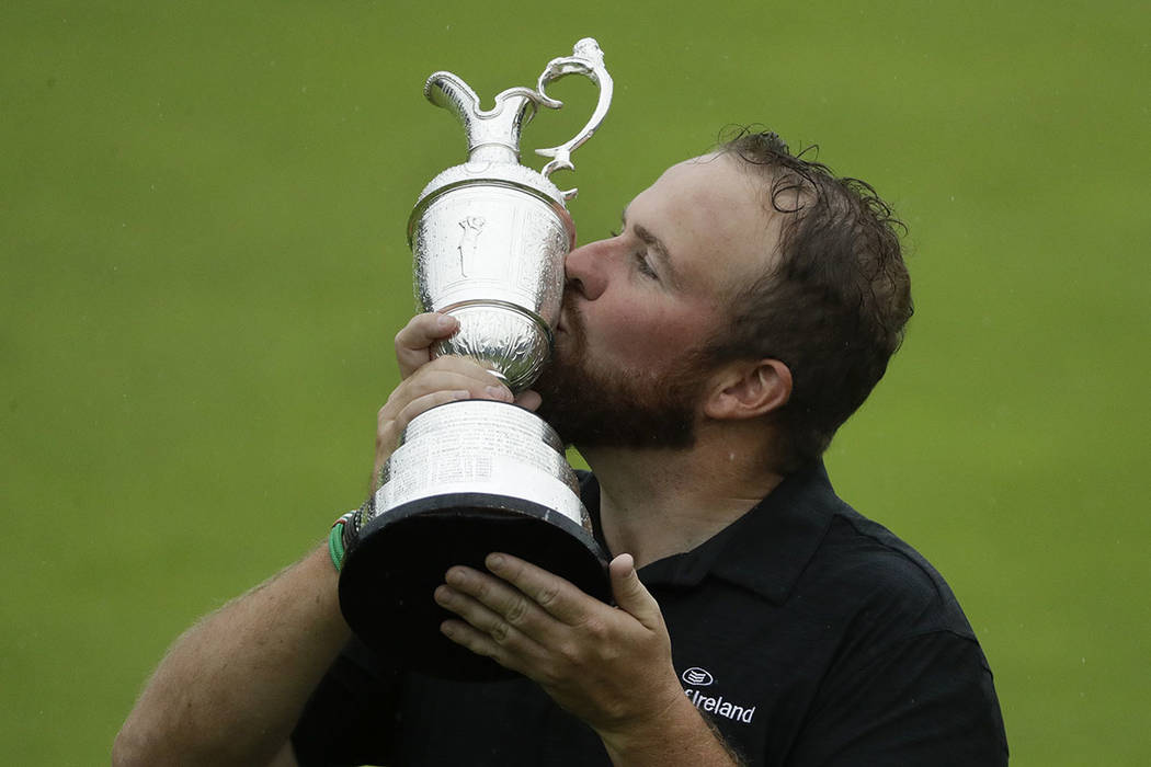 Ireland's Shane Lowry holds and kisses the Claret Jug trophy after winning the British Open Gol ...