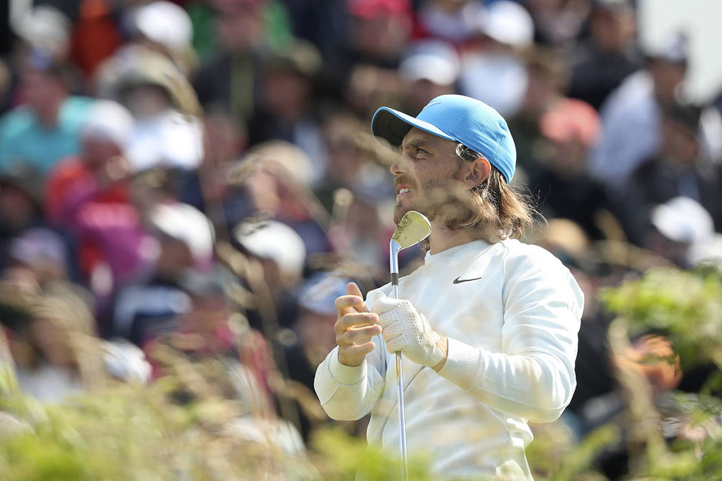 England's Tommy Fleetwood reacts to his shot from the 2nd tee during the third round of the Bri ...