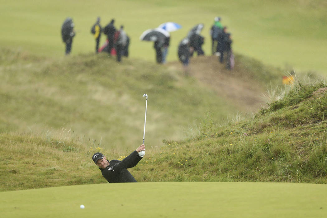 England's Danny Willett plays to the 8th green during the final round of the British Open Golf ...