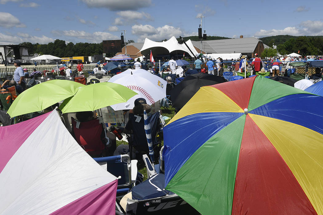 Fans wait for the National Baseball Hall Of Fame induction ceremony at the Clark Sports Center ...