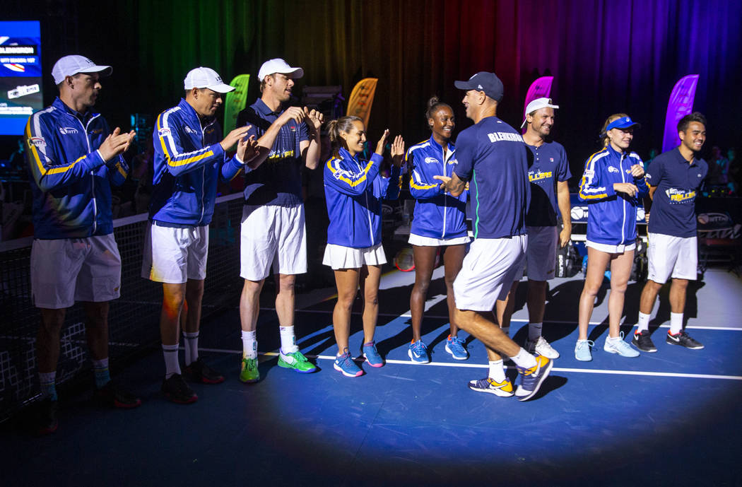 Vegas Rollers head coach Tim Blenkiron greets his team as they take the court for the second ho ...