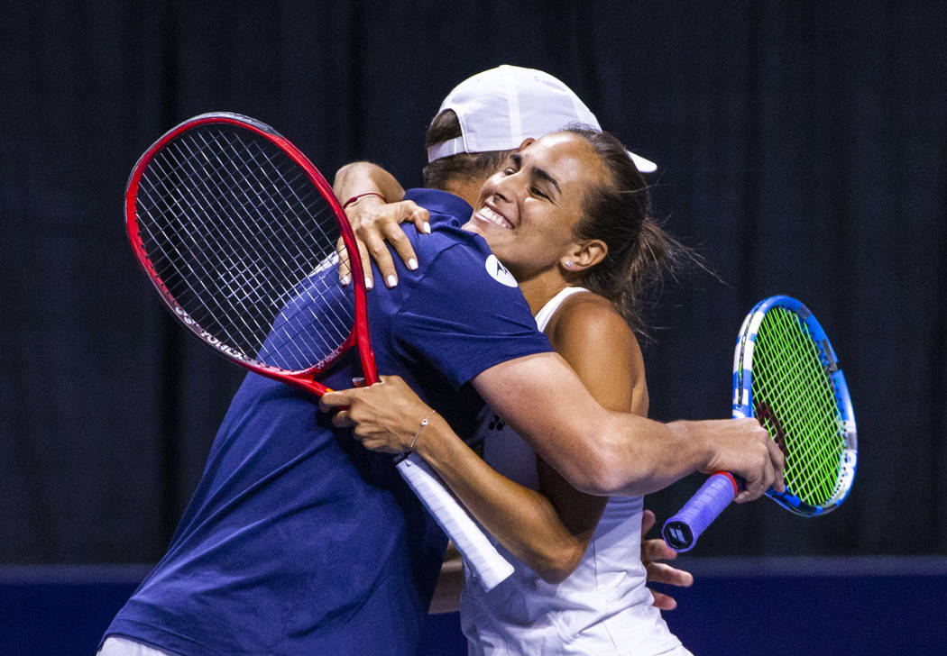 The Vegas Rollers' Bob Bryan, left, embraces mixed doubles parter Monica Puig after a victory o ...