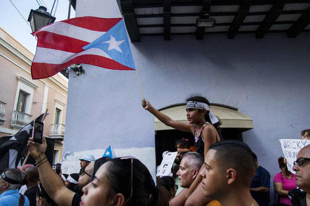 Demonstrators protest against Gov. Ricardo Rossello in San Juan, Puerto Rico, Sunday, July 21, ...