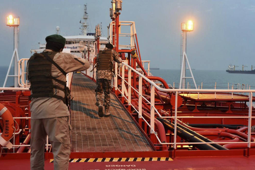 In this Sunday, July 21, 2019 photo, two armed members of Iran's Revolutionary Guard inspect th ...