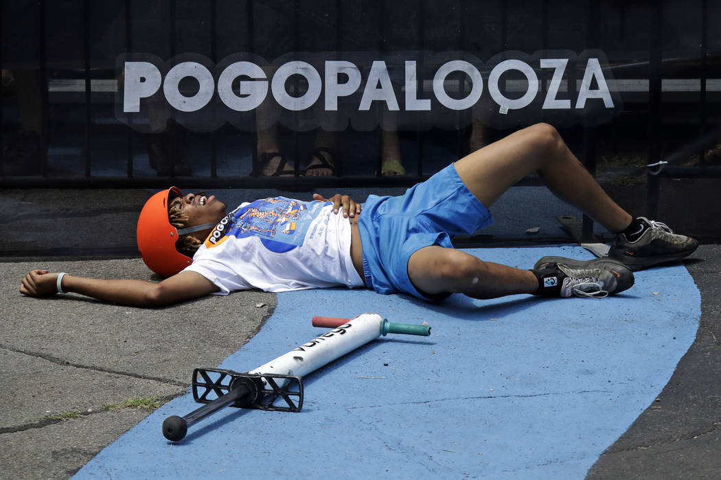 Antonie Smith, 16, of Memphis, Tenn., holds his side after taking a spill during his performanc ...