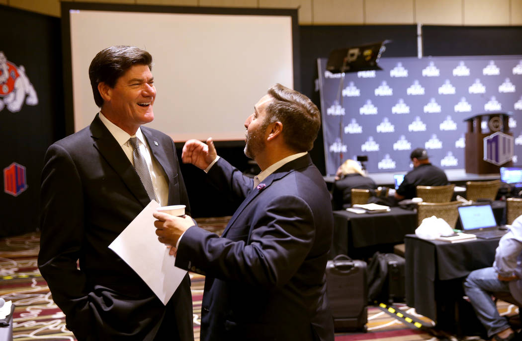 Mountain West commissioner Craig Thompson, left, talks with Las Vegas Bowl Executive Director J ...