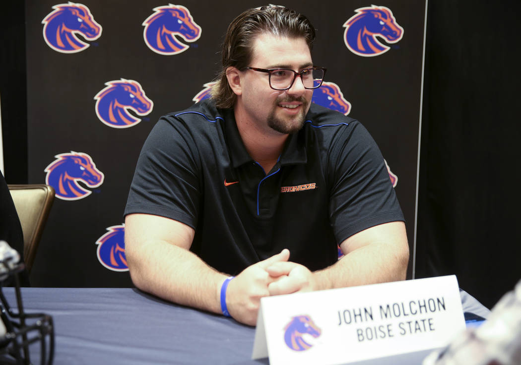 Boise State offensive lineman John Molchon talks to reporters during Mountain West football med ...