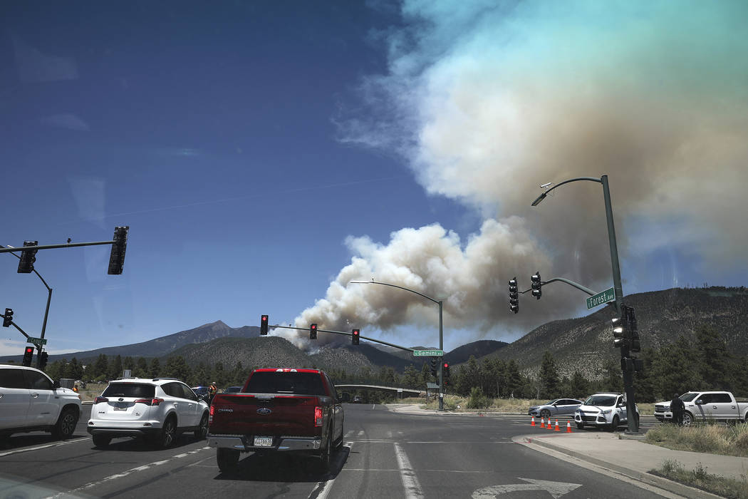 The Museum fire burns Sunday, July 21, 2019, as seen from the top of Switzer Mesa in Flagstaff, ...