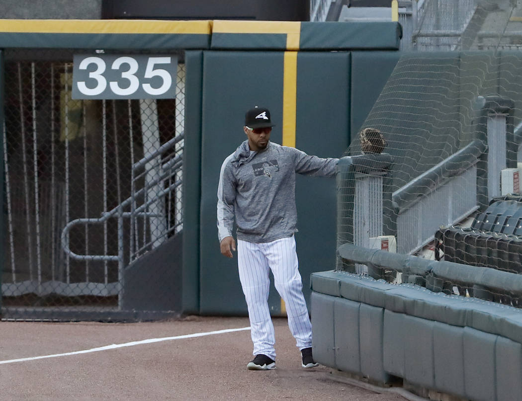 Chicago White Sox's Leury Garcia checks out the new protective netting that was extended to the ...