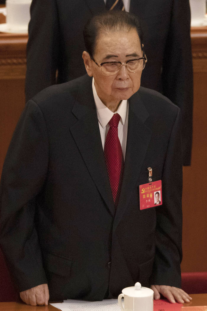 In this Oct. 24, 2017, photo, former Chinese Premier Li Peng, stands during the closing session ...