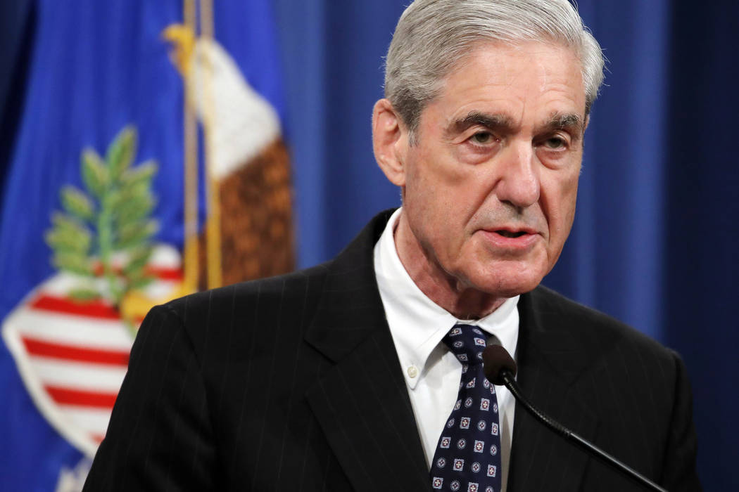 In a May 29, 2019, file photo, Special counsel Robert Mueller speaks at the Department of Justi ...