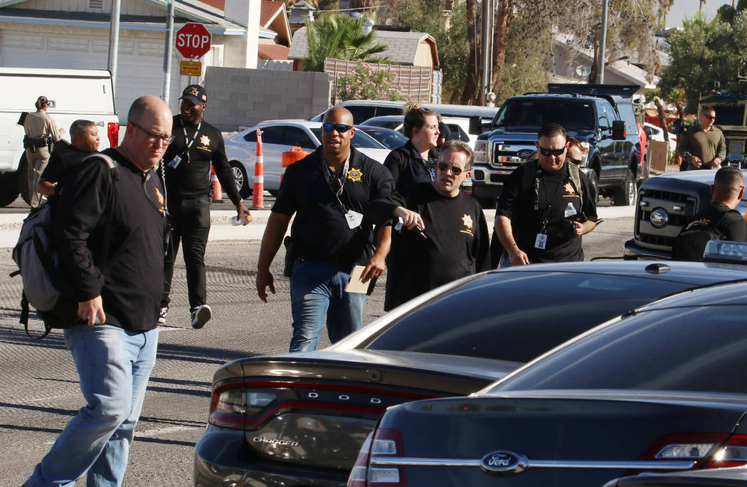 Metropolitan Police Department officers and vehicles at a barricade situation on the 5400 block ...