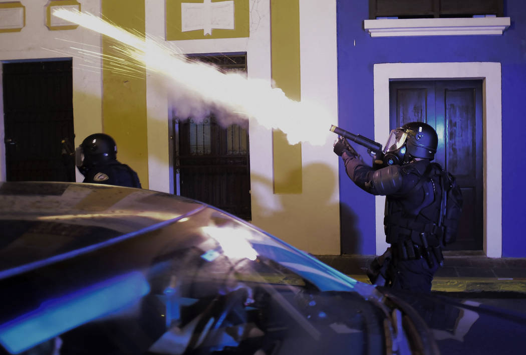 Police units launch tear gas to control several riots near the executive mansion while demonstr ...