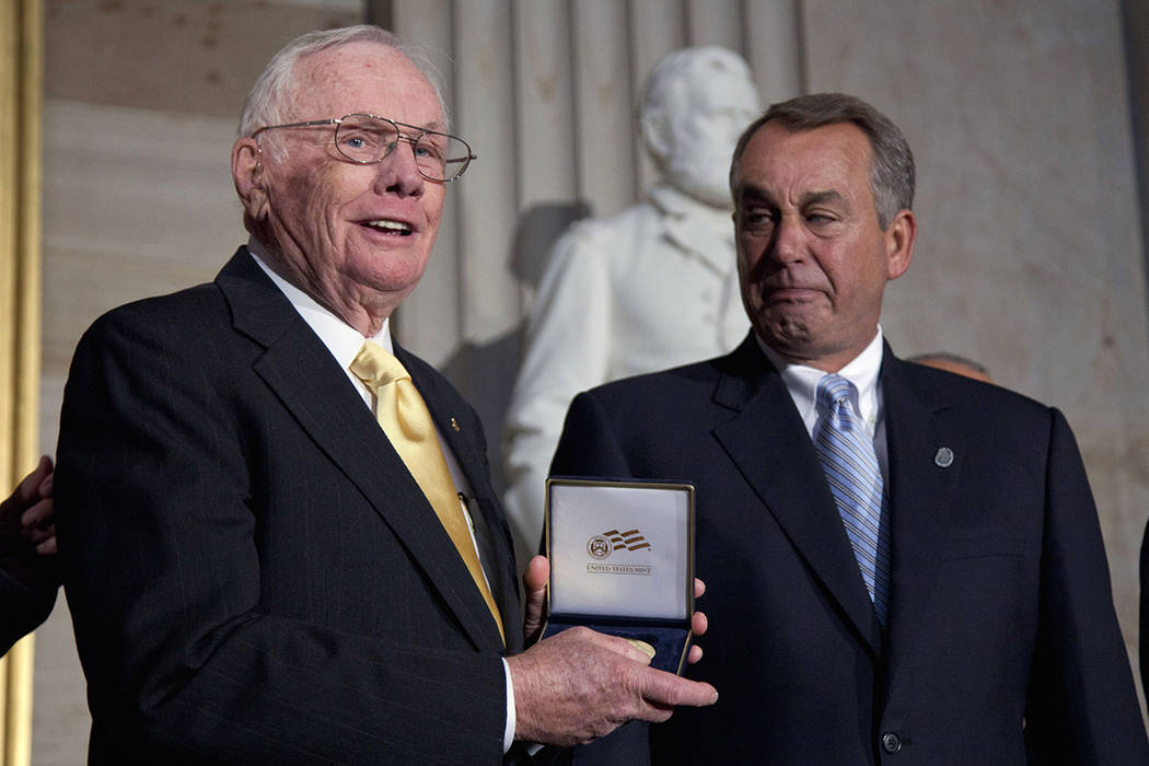 FILE - In this Nov. 16, 2011 file photo, House Speaker John Boehner of Ohio, right, presents a ...