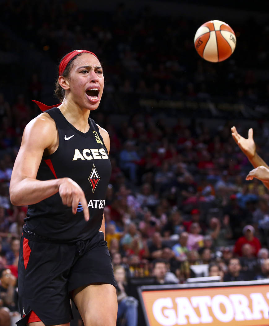 Las Vegas Aces' Dearica Hamby celebrates after scoring against Seattle Storm during the second ...