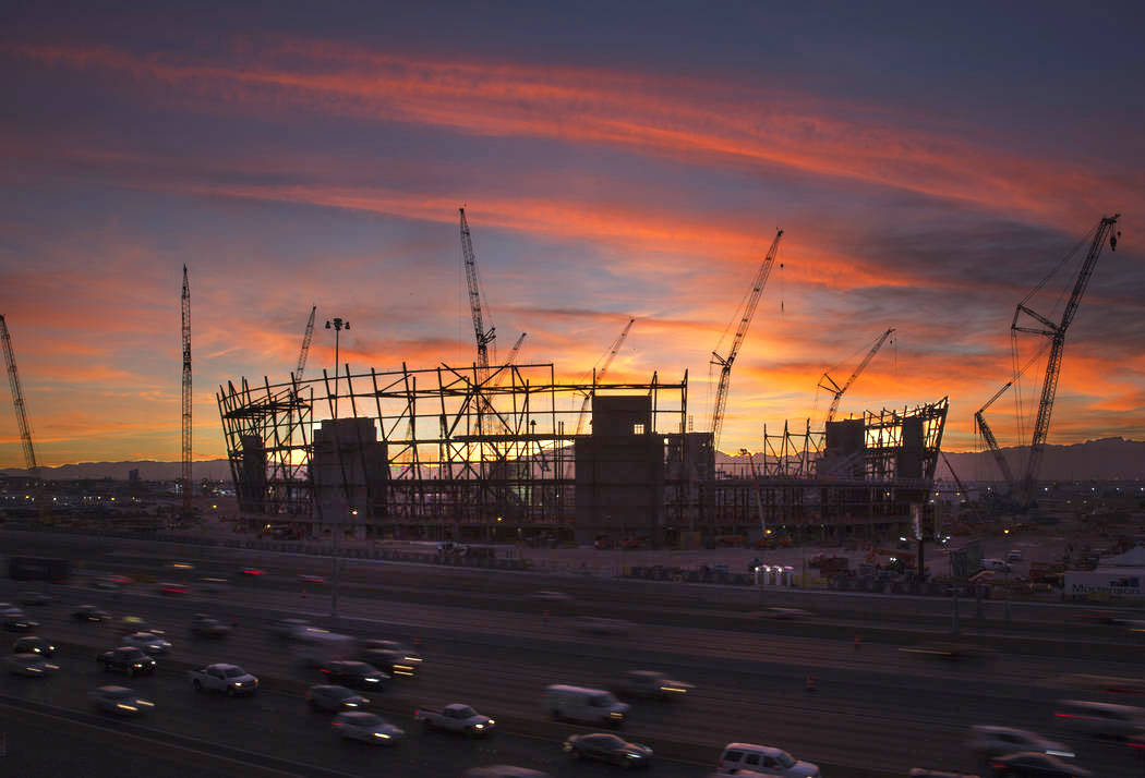 The sun sets behind the under-construction Las Vegas Stadium in Las Vegas on Wednesday, Dec. 19 ...