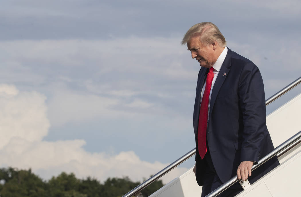 President Donald Trump disembarks Air Force One upon arrival at Wheeling, W.Va., Wednesday, Jul ...