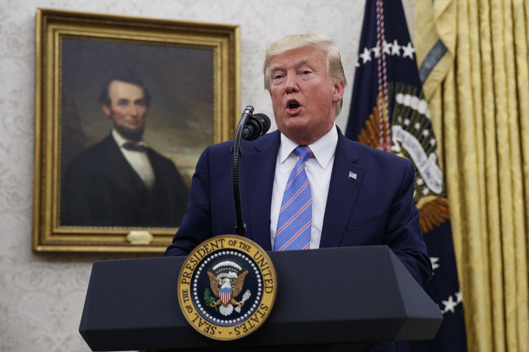 President Donald Trump speaks during a ceremony in the Oval Office of the White House where Mar ...