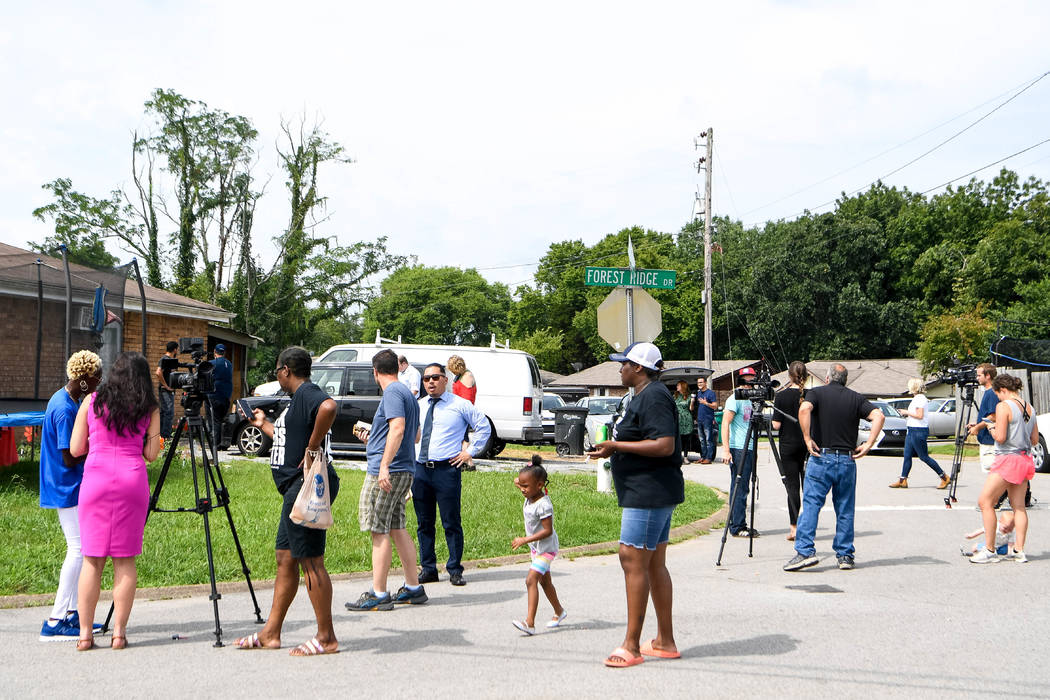 In this Monday, July 22, 2019 photo, media and concerned citizens gather outside a Nashville, T ...