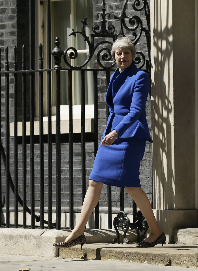 Britain's Prime Minister Theresa May prepares to face the media as she leaves 10 Downing Street ...