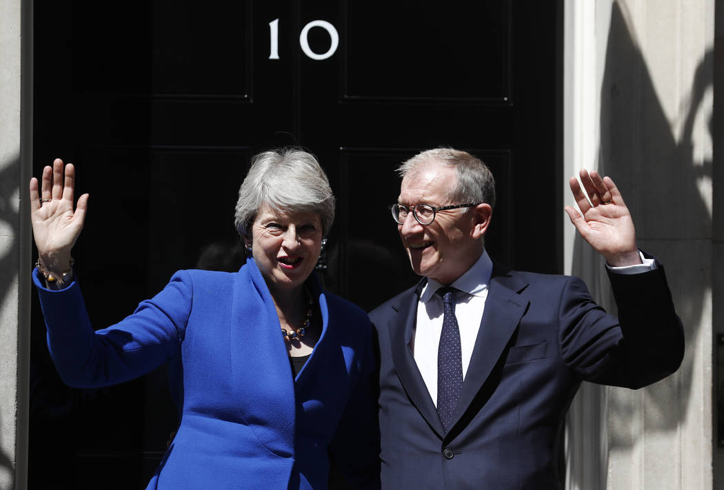 Britain's Prime Minister Theresa May and her husband Philip waves from the steps of 10 Downing ...