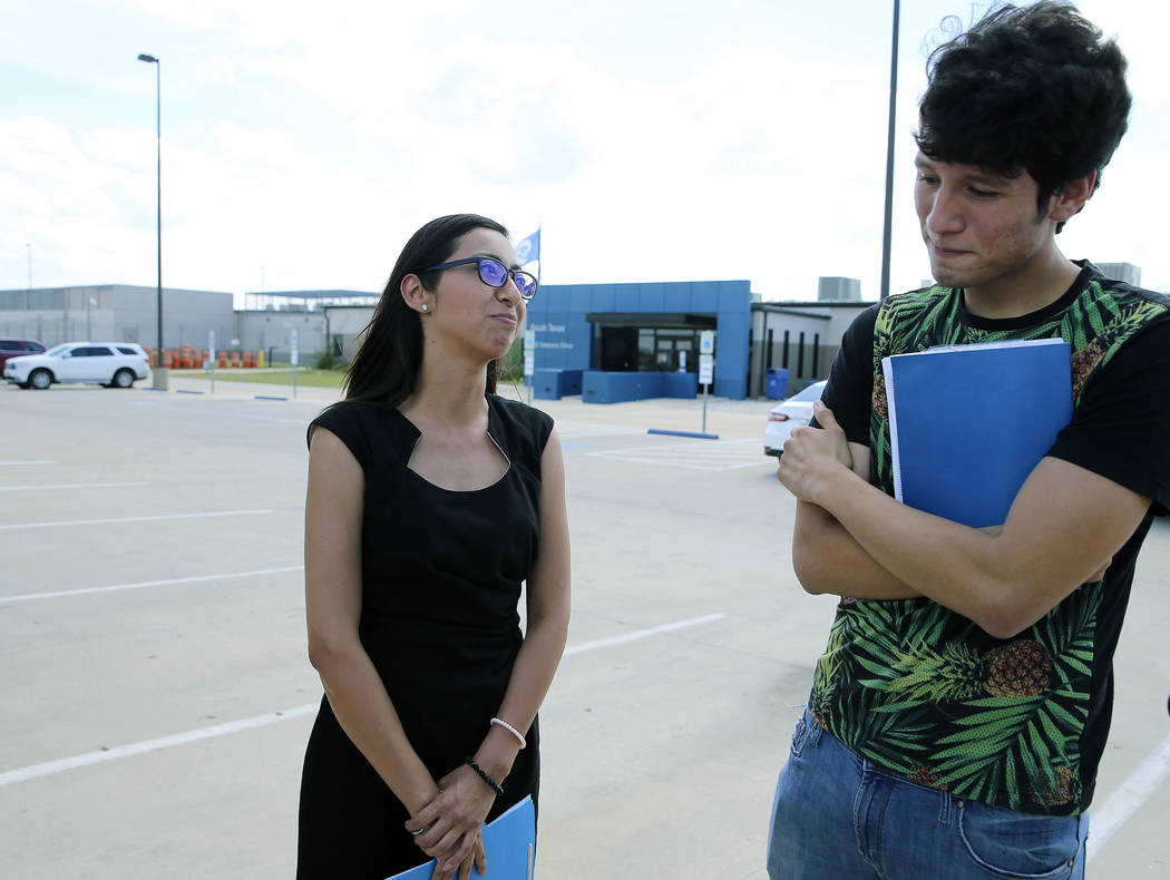 U.S. citizen Francisco Galicia, right, 18, chats with his attorney, Claudia Galan, left, after ...