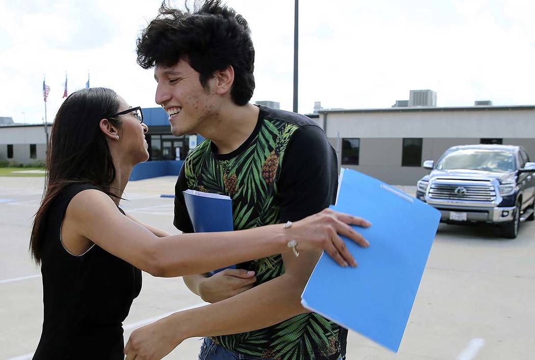 U.S. citizen Francisco Galicia, 18, gets a hug from his attorney, Claudia Galan, after his rele ...