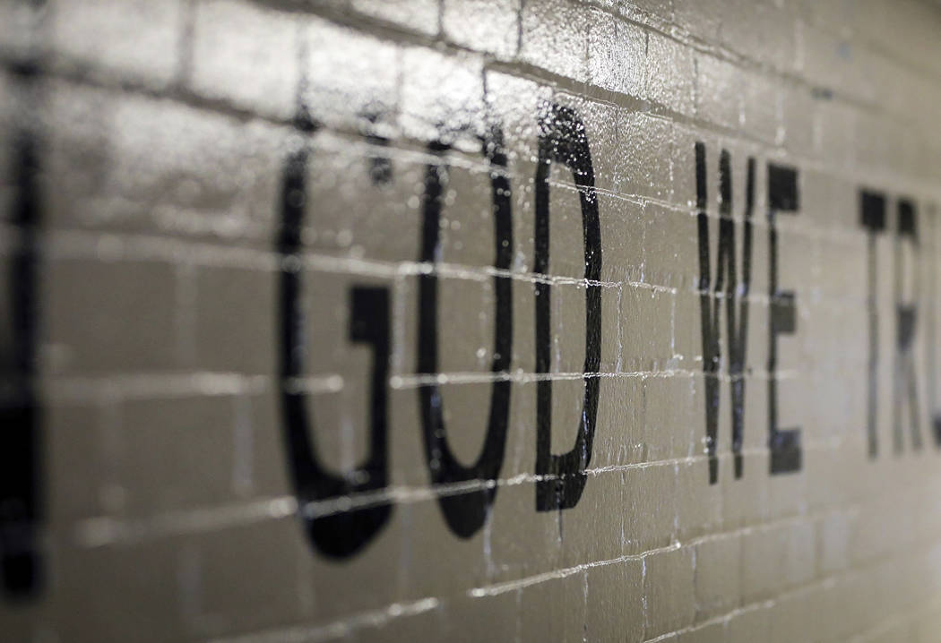 This July 23, 2019 photo shows "In God We Trust" stenciled in a wall at South Park Elementary i ...