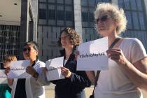 Protestors hold signs that read "Defend Asylum" outside of the San Francisco Federal ...