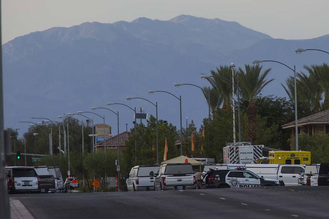 Las Vegas police respond to a barricade situation near Fort Apache and Russell roads in Las Veg ...