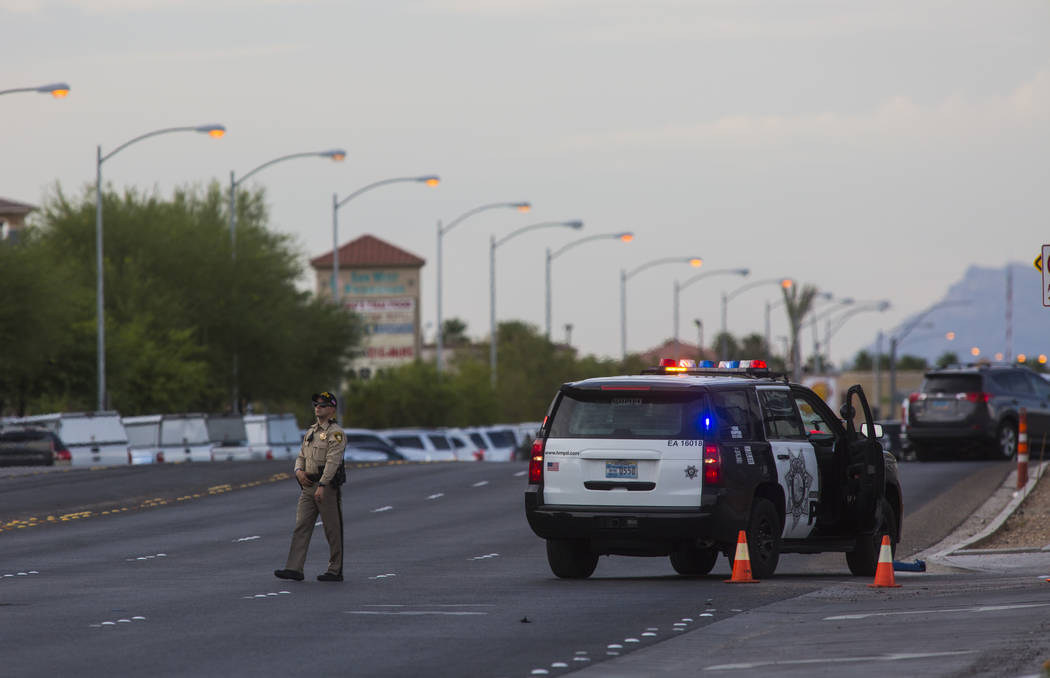 Las Vegas police respond to a barricade situation near Fort Apache and Russell roads in Las Veg ...