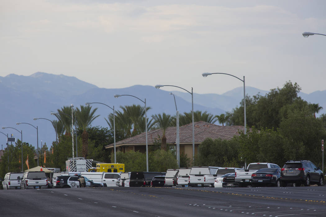 Las Vegas police respond to a barricade situation near Fort Apache and Russell roads in Las Veg ...