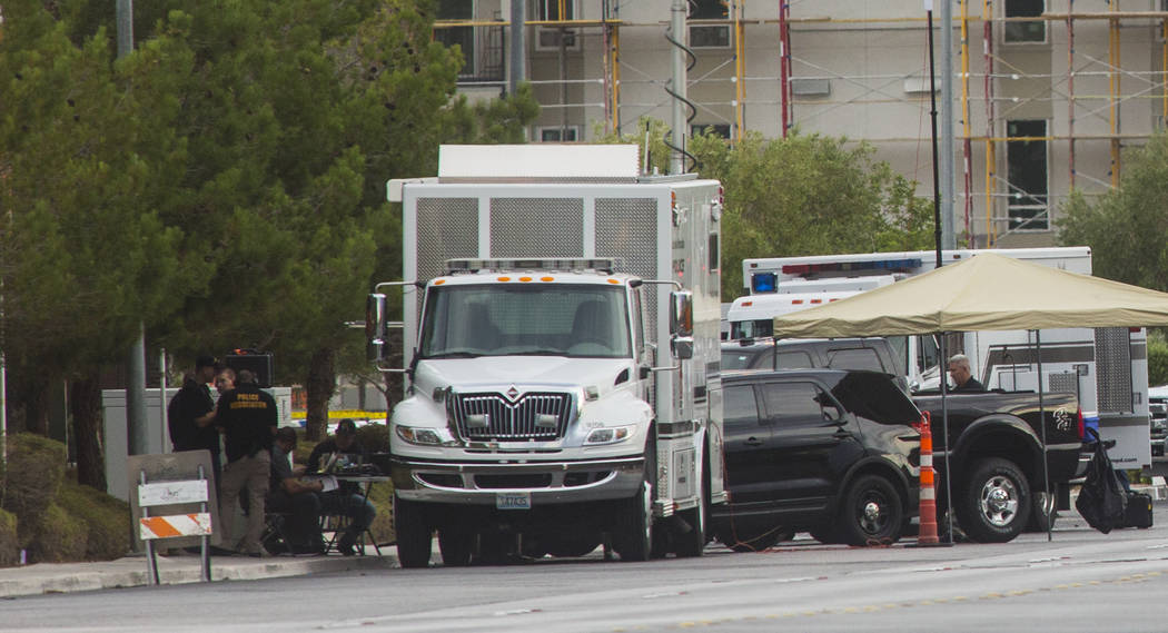 Las Vegas police respond to a barricade situation near Fort Apache and Russell roads in Las Veg ...